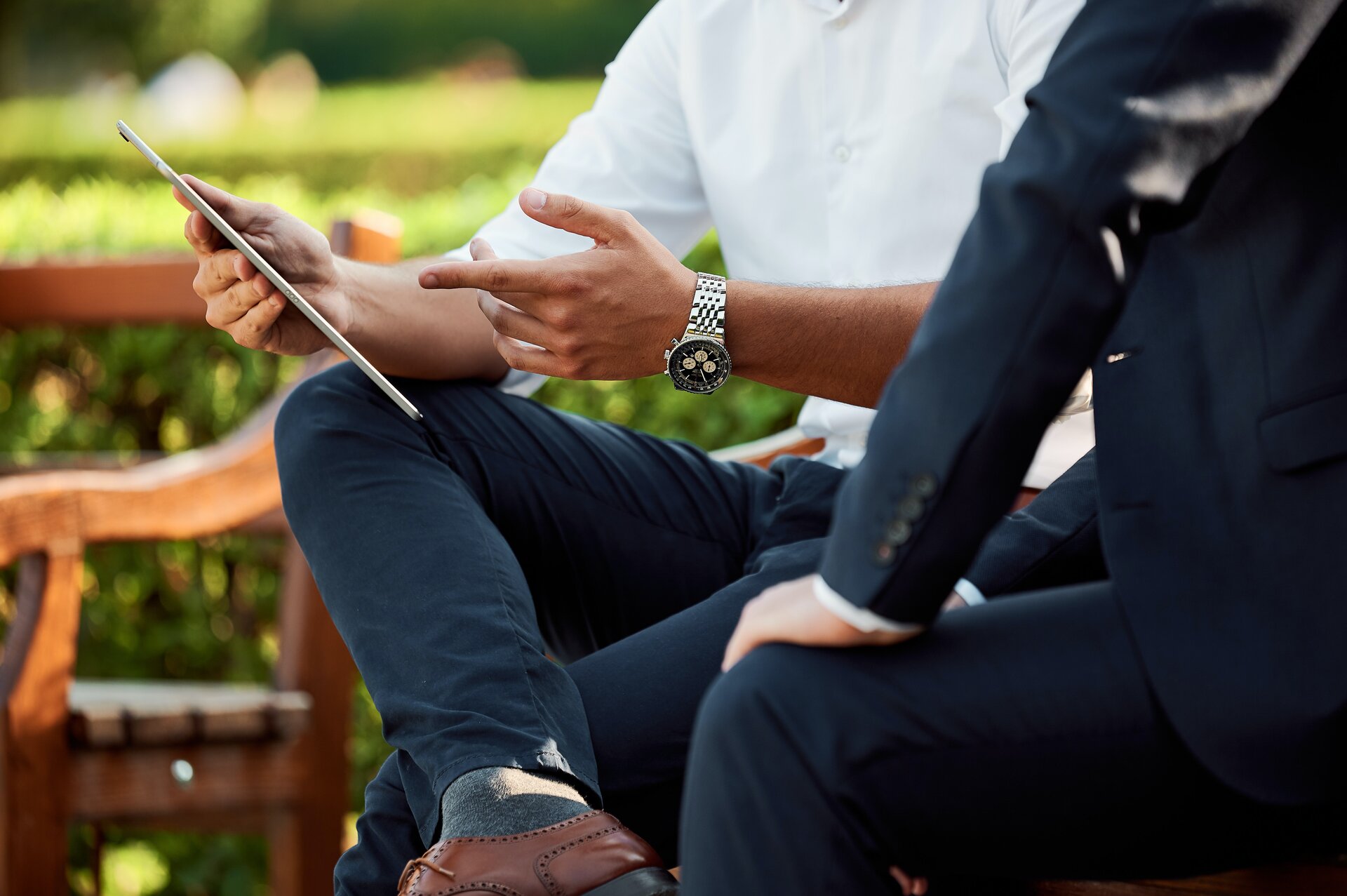 Businessmen on a tablet